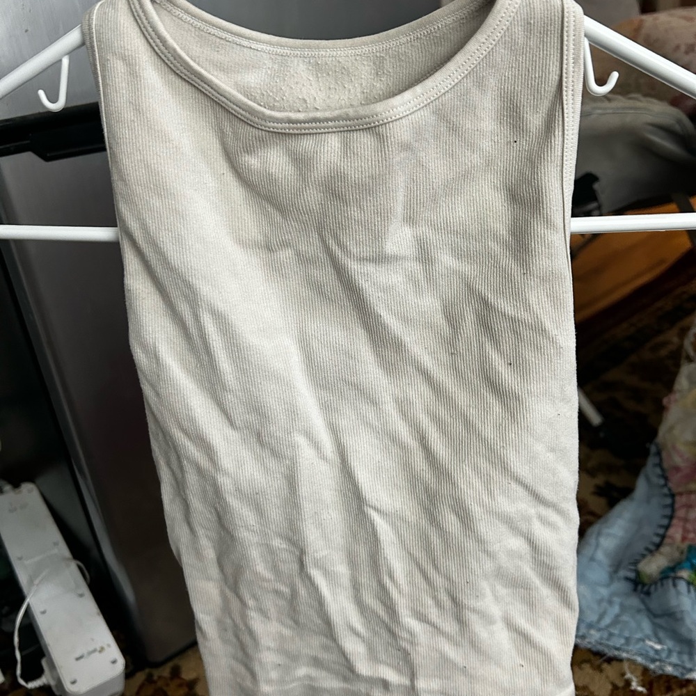 Cream sleeveless tank top with crew neck